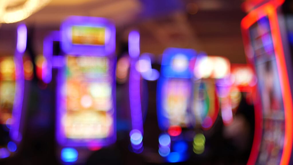 Defocused,Slot,Machines,Glow,In,Casino,On,Fabulous,Las,Vegas